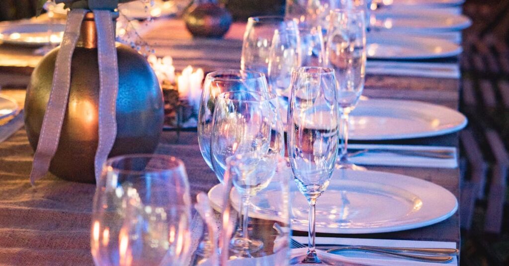 A beautifully set dinner table with candles and glassware, perfect for elegant events.